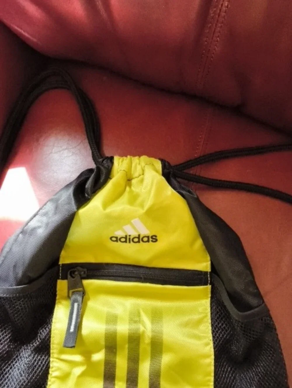 Adidas Black and Yellow Drawstring Backpack with Front Zip Pocket